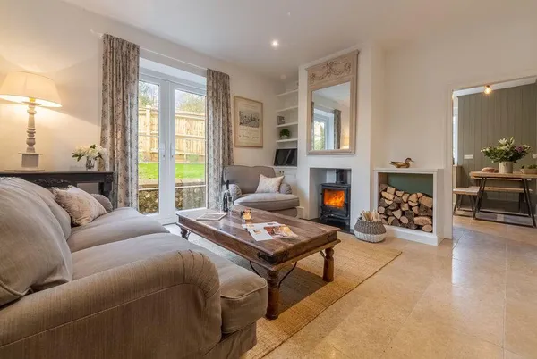 1 Church Cottages living room with wood burner and stacked logs