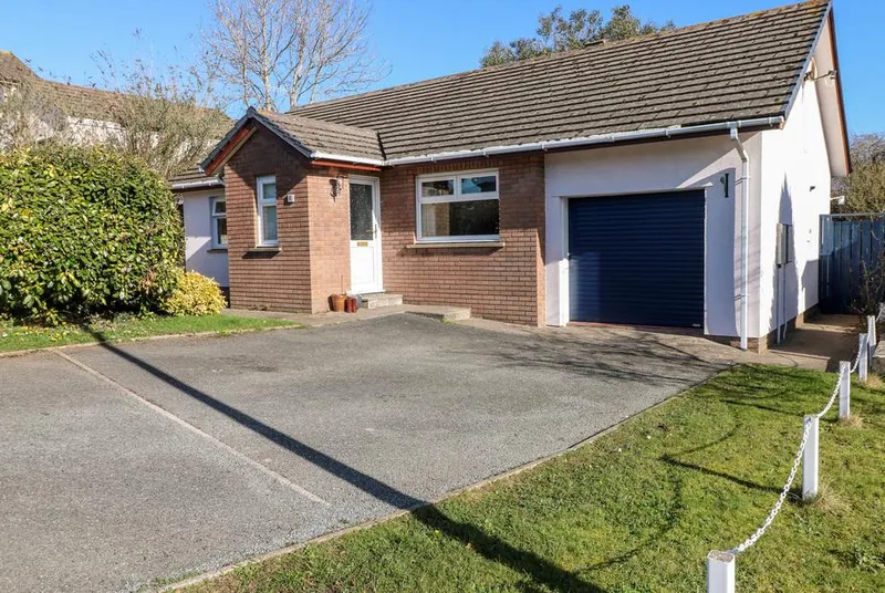1 Gloucester Way detached bungalow exterior with garage and drive