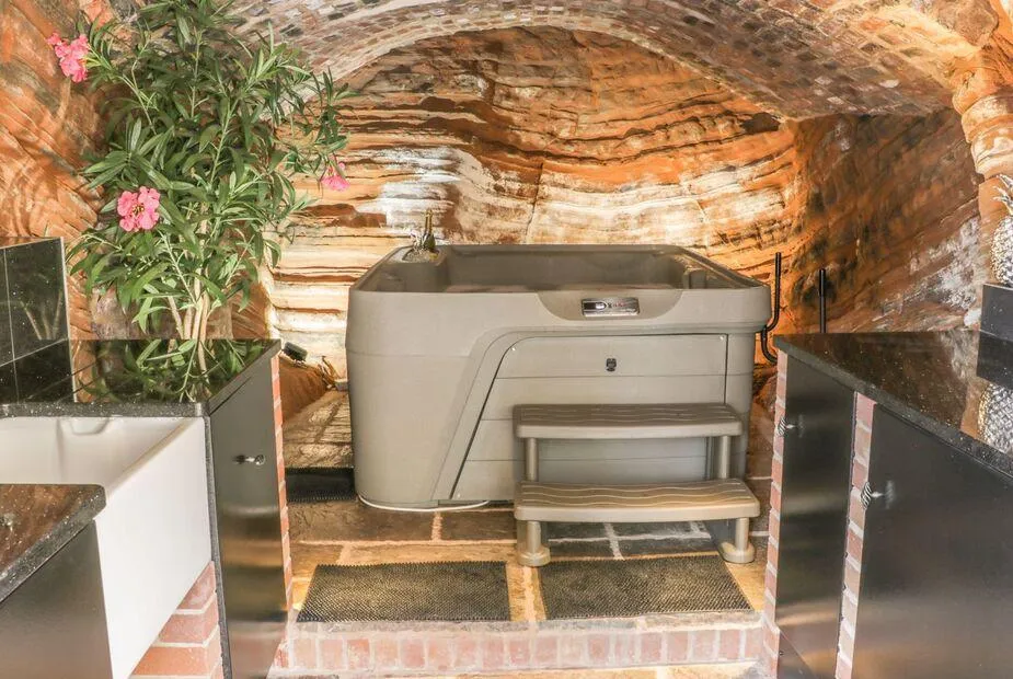31 Riverside cave hot tub in the stone chamber