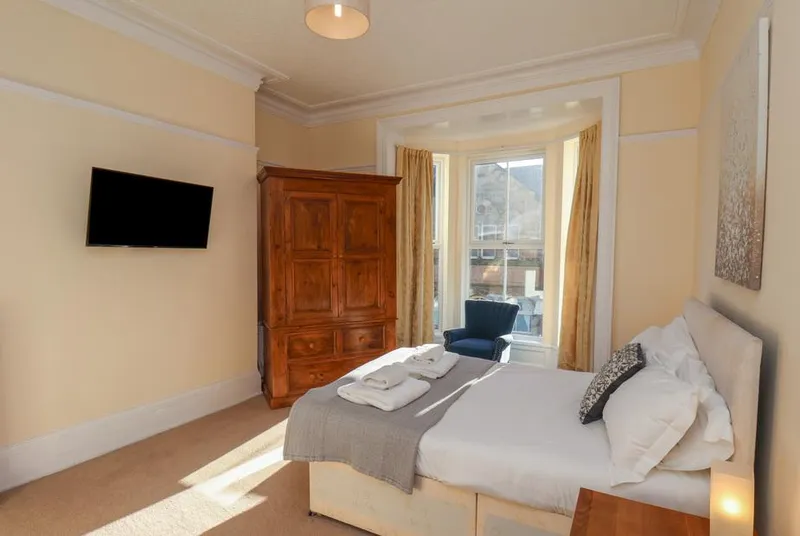 4 Normanby Terrace bay window bedroom with antique wardrobe