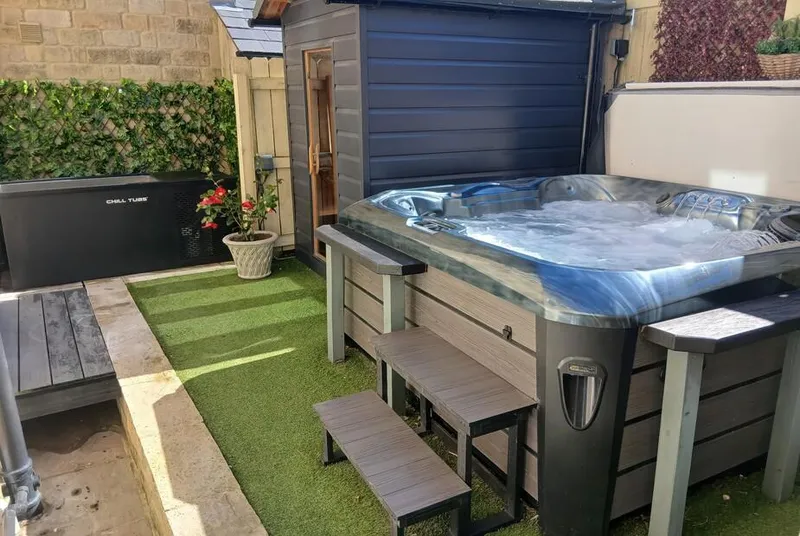 Lock View Nordic Spa hot tub in garden with steps and planting