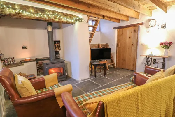 Bwthyn Lan character lounge with wood burner and beams