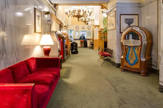 Living room with a red couch and a table
