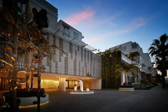 Building with a sculpture in front of it