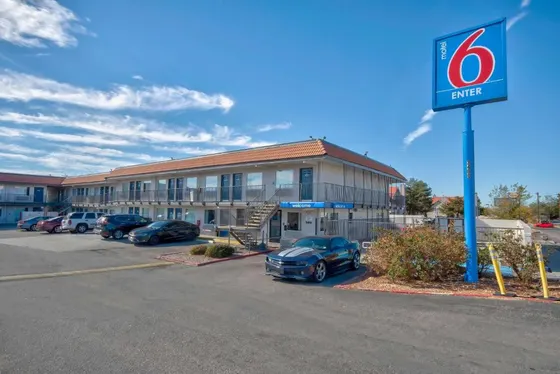 Two-story motel with exterior walkways and a Motel 6 sign