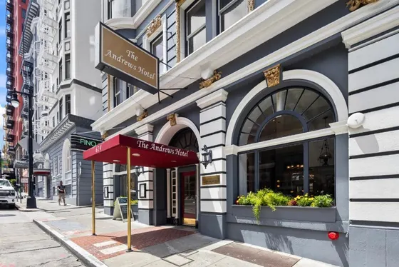 Building with a red awning on a city street