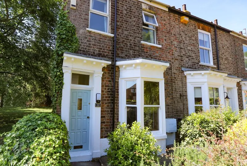 Baggergate House Victorian terraced front with garden in sunshine