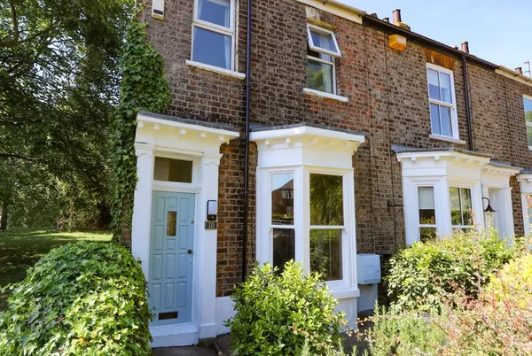 Baggergate House Victorian terraced front with garden in sunshine