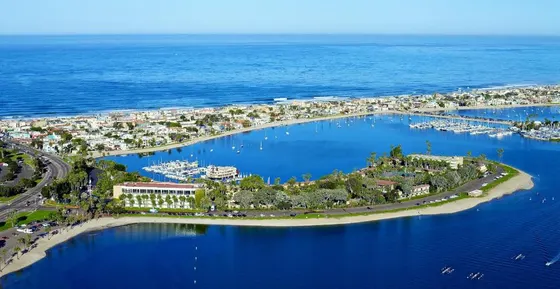 Aerial view of a resort with boats in a harbor