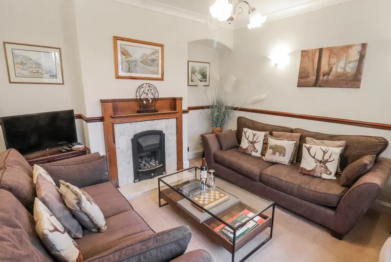 Beachcrest living room with fireplace and two sofas
