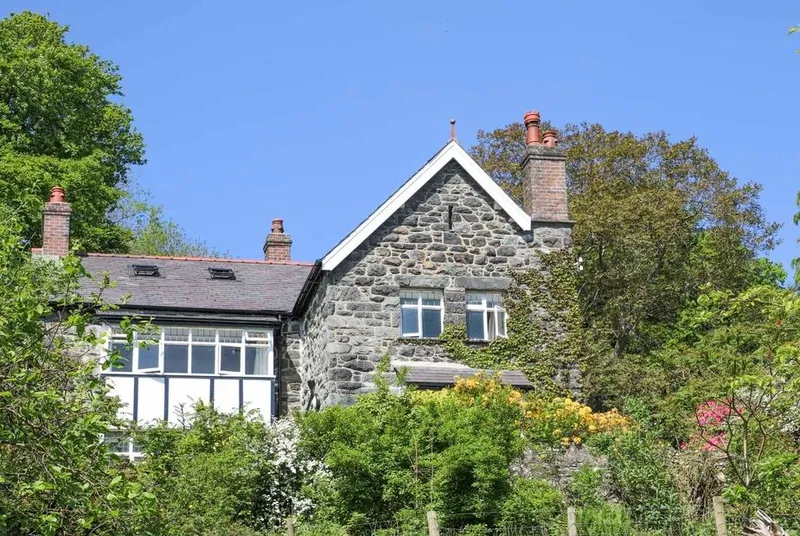 Ty'n y Cae stone house exterior above the valley