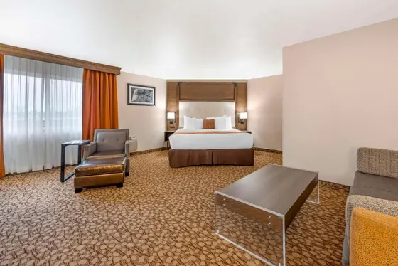 Hotel room with a bed and a chair