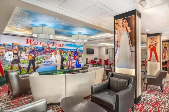 Waiting room with chairs and a wall of fame
