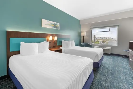 Hotel room with two beds and a window