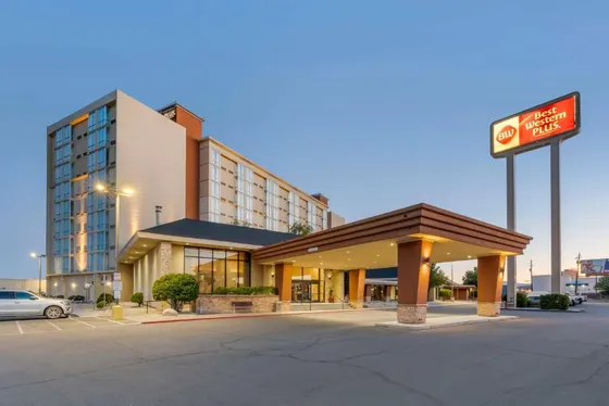 Hotel with a sign in front of a building