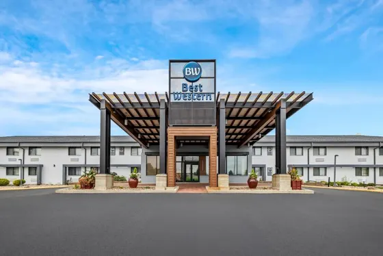 Building with a sign for a car dealership