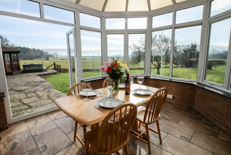 Bicton Lea conservatory dining area with countryside beyond