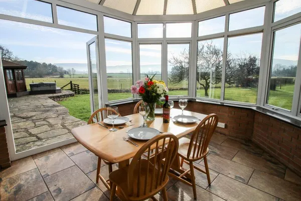 Bicton Lea conservatory dining area with countryside beyond