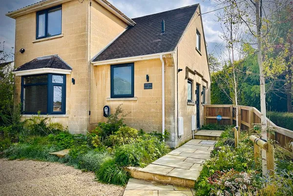 Birch House Cotswold stone frontage with planted garden path
