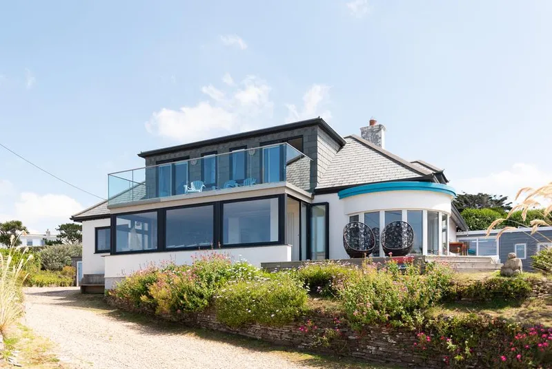 Blue Bay Beach House exterior with sweeping coastal view