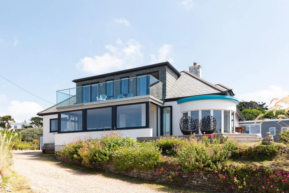 Blue Bay Beach House exterior with sweeping coastal view