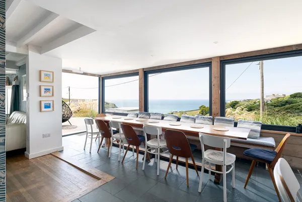 Blue Bay Beach House long dining room with wide glazing