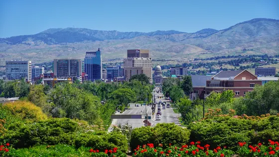 Downtown Boise and the Idaho State Capitol with foothills behind them