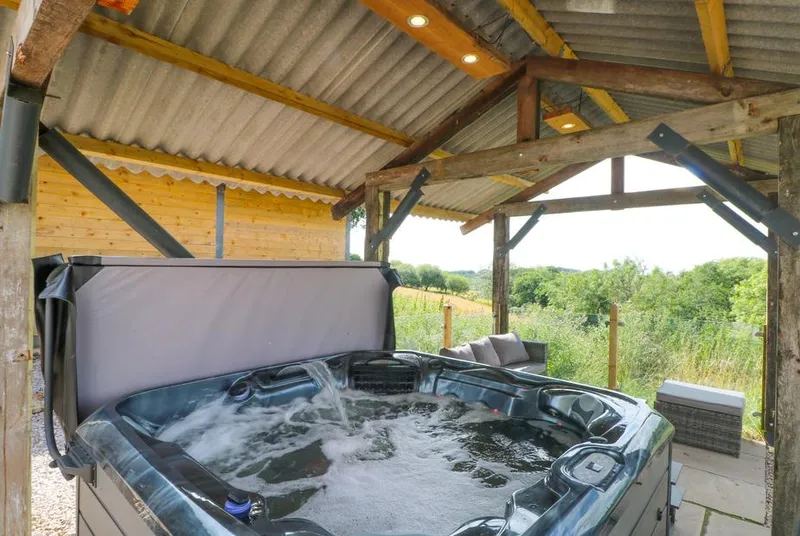Bowland Barn covered hot tub with open countryside views