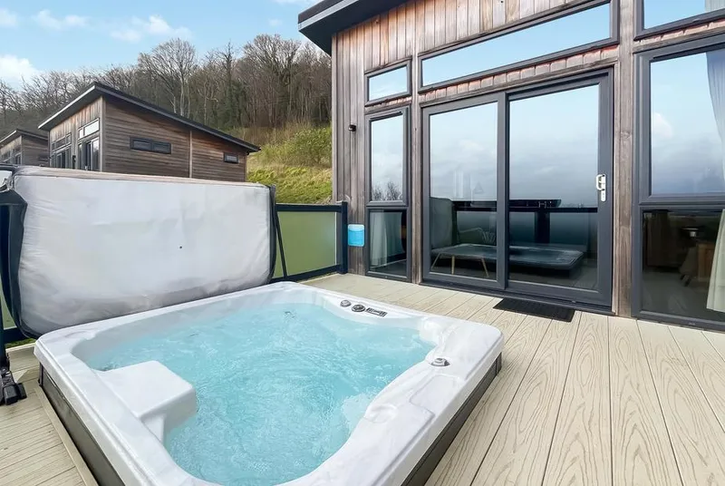 Burrington Premier hot tub on private deck with lodge glass frontage