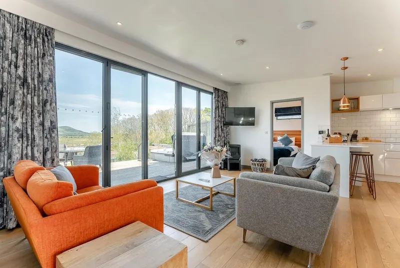 Caburn View Retreat open-plan lounge with deck views