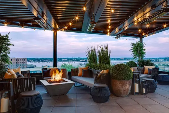 Patio with a fire pit and a view