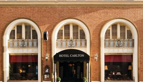 Brick building with three windows and a hotel challenger