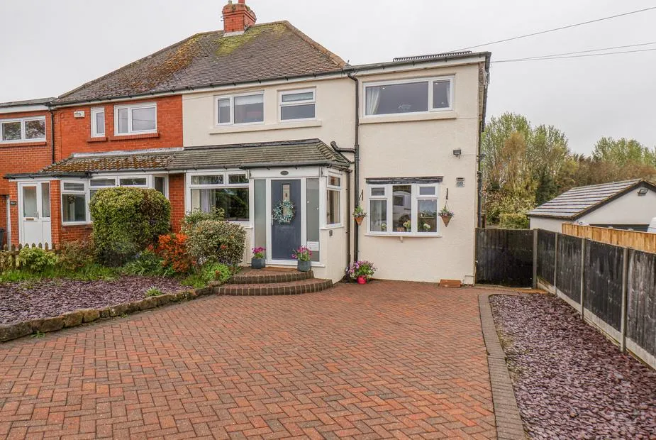 Castle View full front view with driveway and front garden