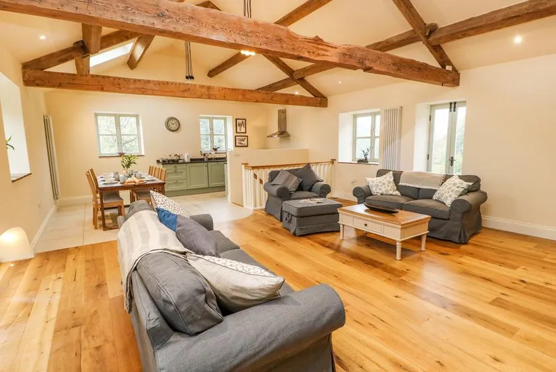 Morgan's Barn open-plan living with vaulted oak beams and skylights