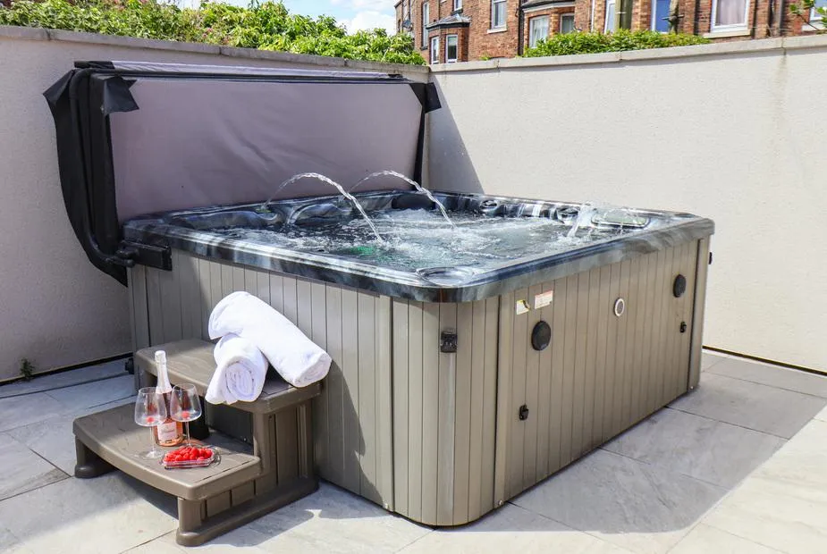 Church View hot tub with water jets running and champagne staging