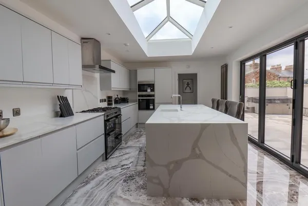 Church View kitchen with marble waterfall island and onyx floor tiles