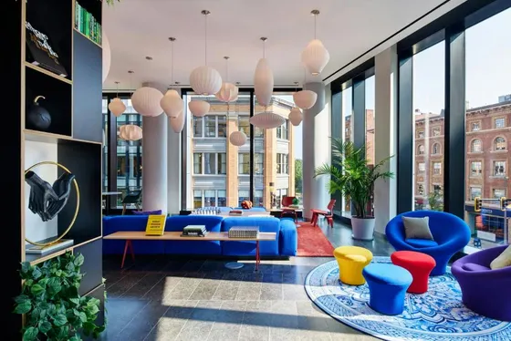 Lobby with blue furniture and large windows