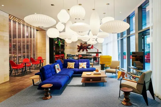 Living room with a blue couch and chairs