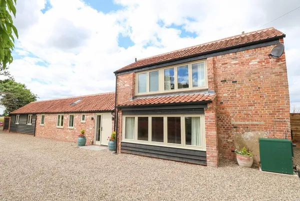 Cobblers Barn two-storey brick barn conversion with pantile roof