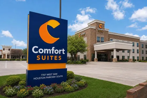 Navy Comfort Suites monument sign in front of the hotel