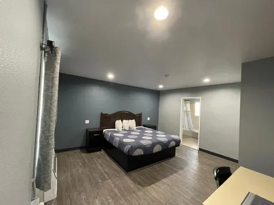 Bedroom with a bed and a blue wall