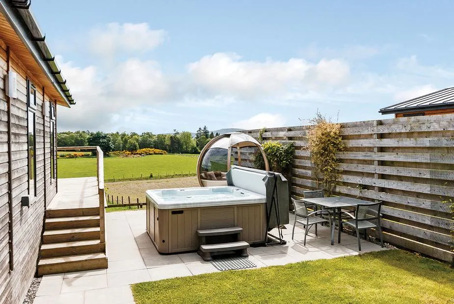 Cromarty Lodge hot tub beside the lodge and open lawn