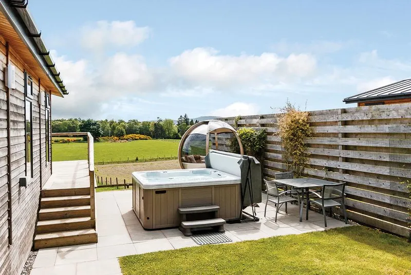 Cromarty Lodge hot tub beside the lodge and open lawn