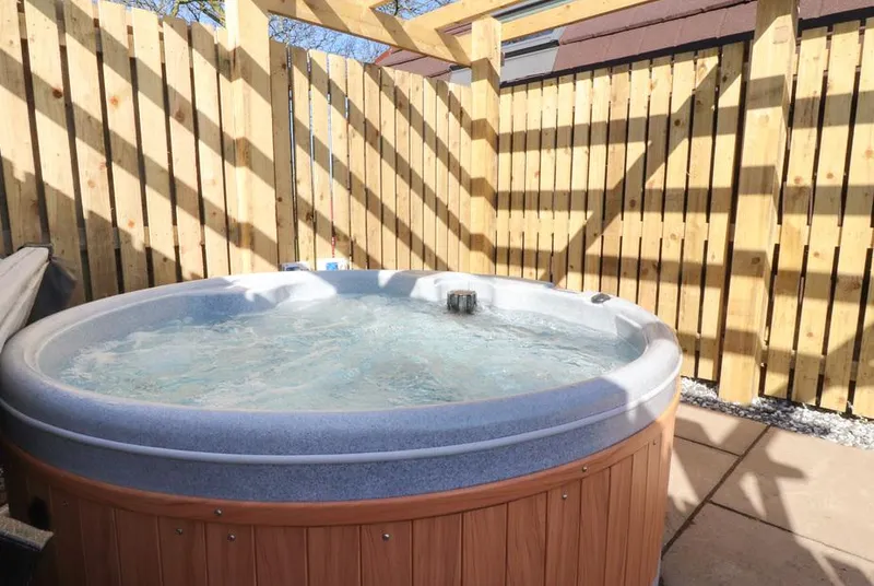 Curlew Corner bubbling hot tub on a private deck