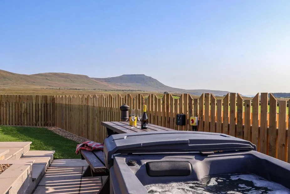 Curlew hot tub with Ingleborough fell backdrop at golden hour