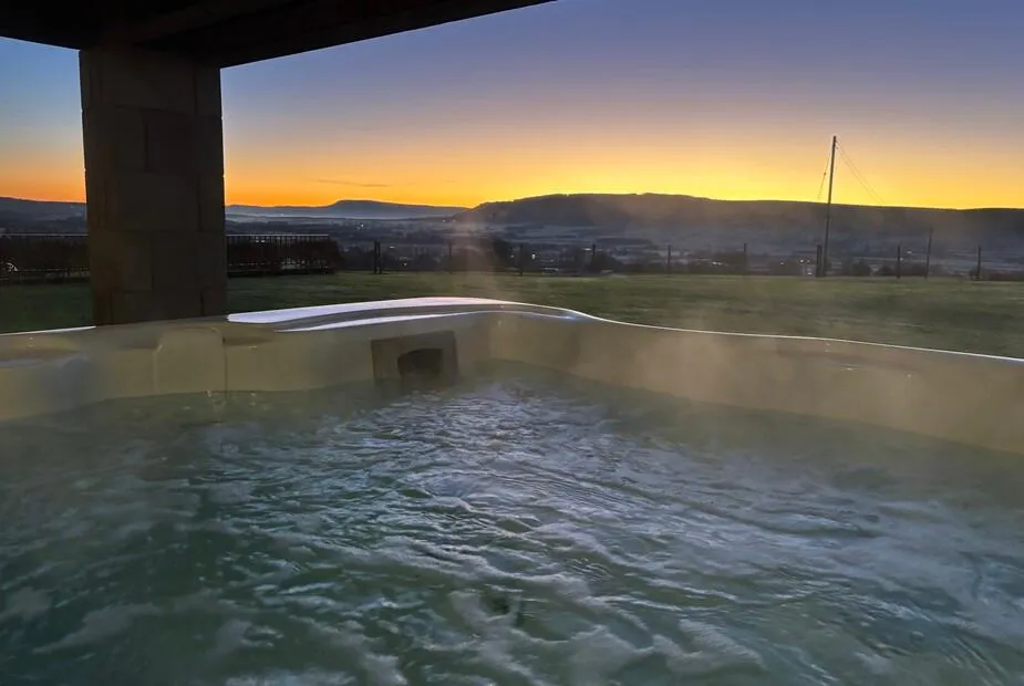 Cuthbert Hill Farm infinity pool at sunset with countryside views