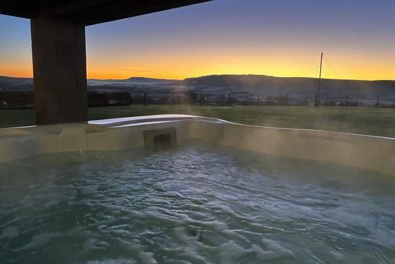 Cuthbert Hill Farm infinity pool at sunset with countryside views