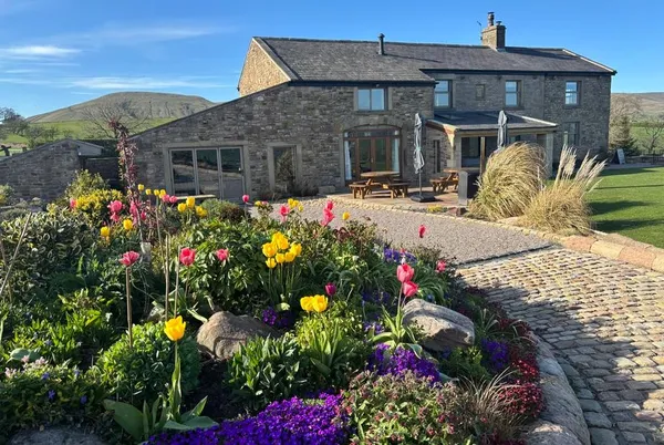 Cuthbert Hill Farm farmhouse exterior with gardens and driveway