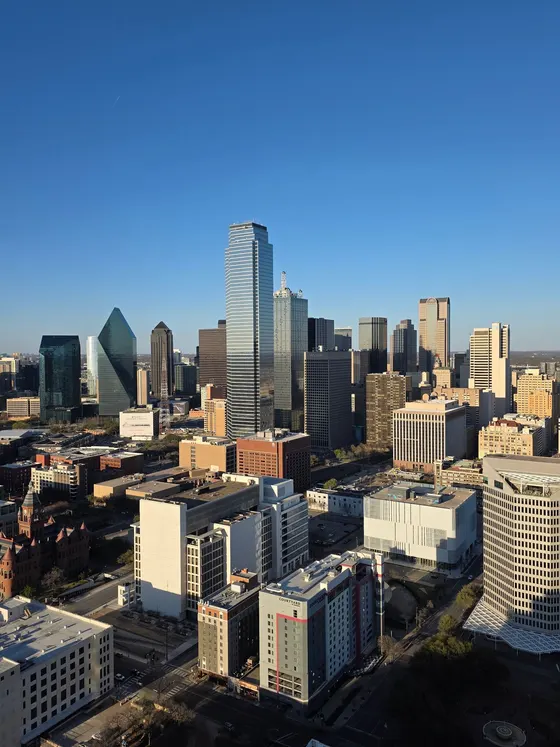 Downtown Dallas skyscrapers under a clear sky