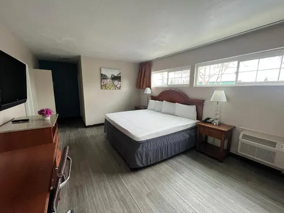 Bedroom with a bed and a flat screen tv